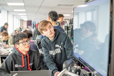 Undergraduate students working at a screen on a group project in the EEE Collaborative Teaching and Project Lab 1, Pope Building BO1