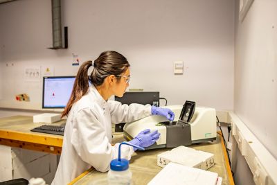 PhD student Jinge You placing a sample within a plastic cuvette in Malvern Zetasizer ZS Nano Dynamic Light Scattering equipment for particle size analysis