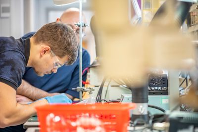 EEE Technical Workshop B17, Senior Technician and UG student working on a project at a Retort stand