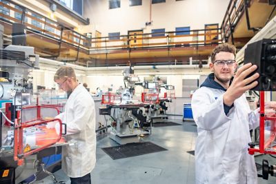 Undergraduate students using the XYZ Milling Machine KMX1500. Milling - face milling then drilling 2 holes