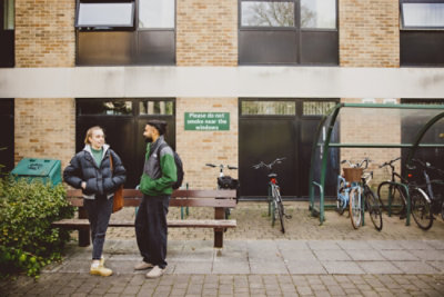 Pair of undergraduate students talking outside the Clive Granger building, University Park campus